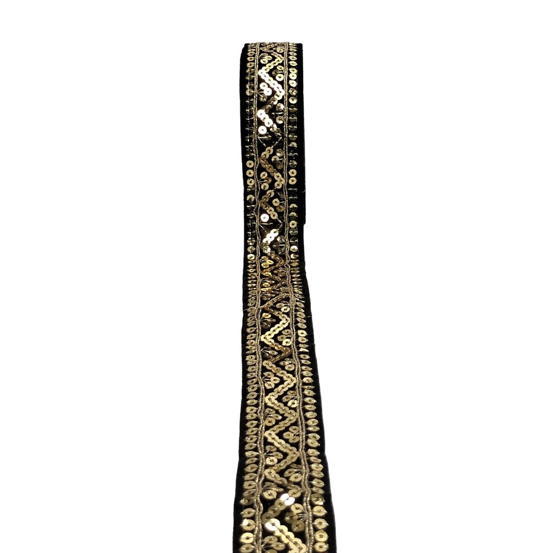 Decorative black and gold trim on a white background